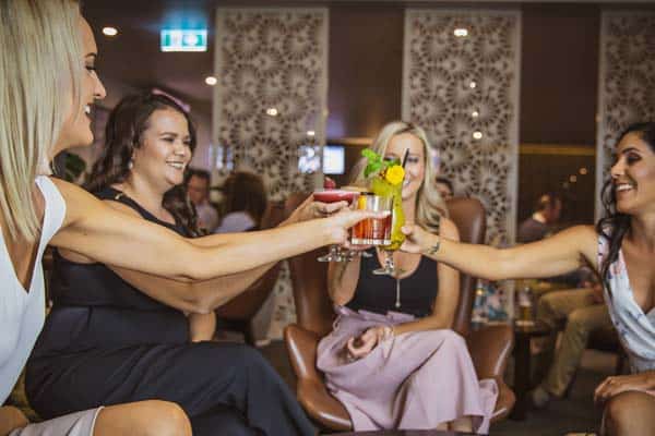 Photo of 4 ladies enjoying cocktails at Jimmy's Bar & Lounge