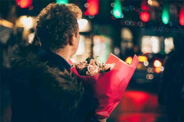 Man holding bunch of roses for Valentine's Day
