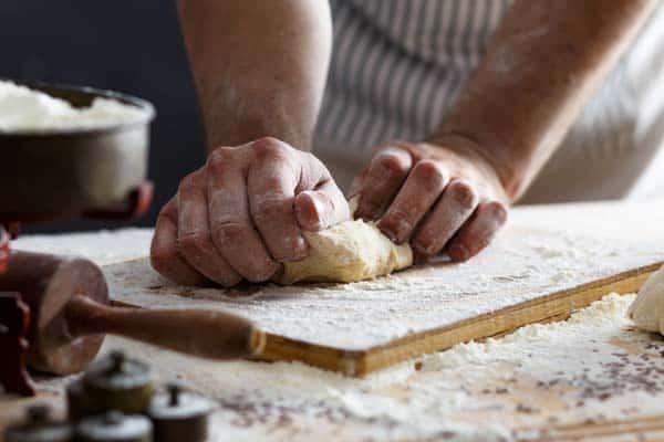 Kneading hot cross buns