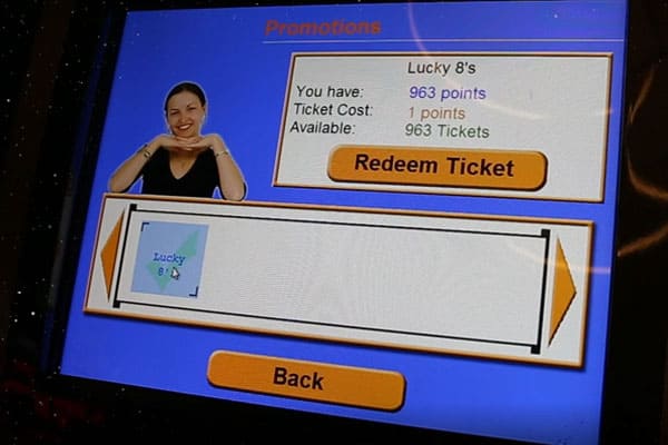 Photo of member redeeming tickets for entries using member kiosk