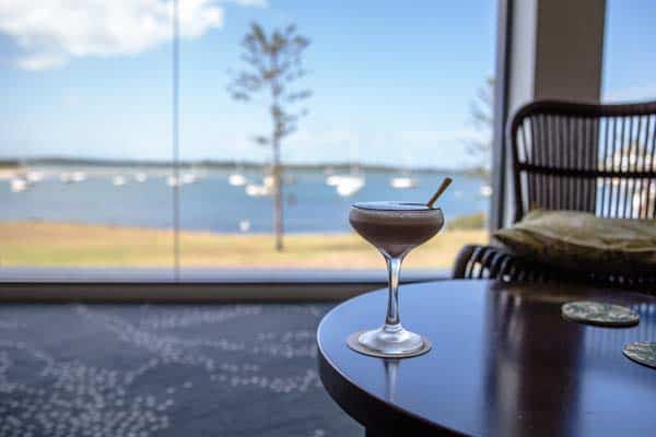 Photo of espresso martini at Jimmy's Bar with water views in background