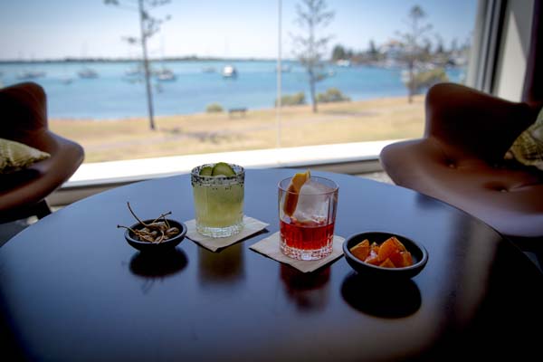 Photo of Jimmy's Bar and Lounge, showing cocktails and water views