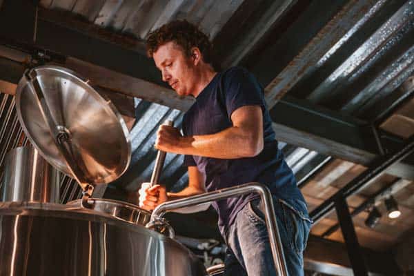 Photo of man brewing beer