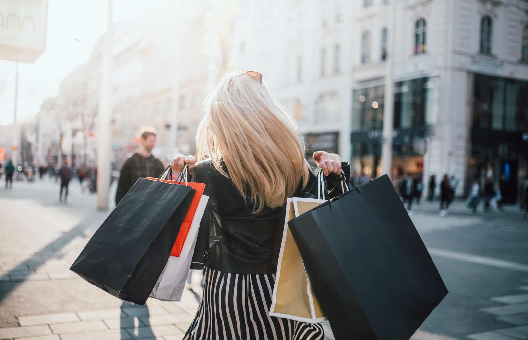 Girl with shopping bags in the street after a spree of spending