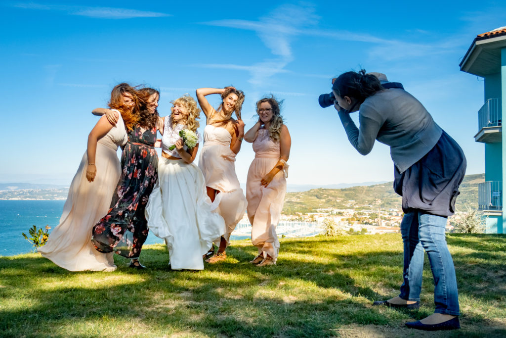 Photographer outdoors wedding in the wind